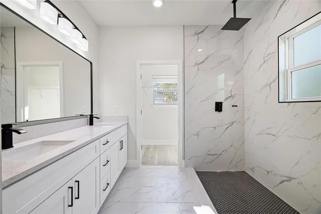 a view of a bathroom with a glass door shower