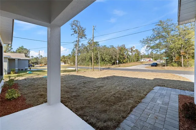 a view of a yard and front view of a house