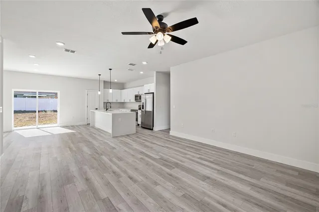a view of a kitchen with a sink and a window