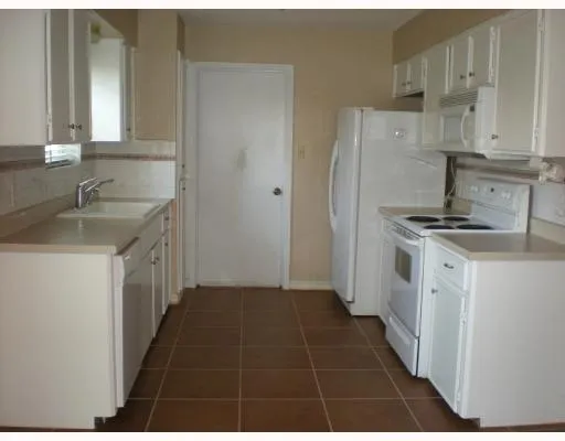 a kitchen with a stove and a sink