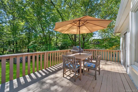 an outdoor space with furniture and umbrella