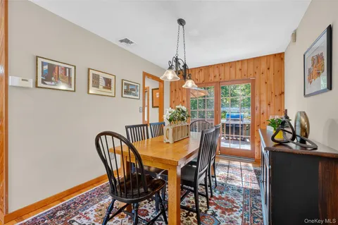 a view of a dining room with furniture window and outside view