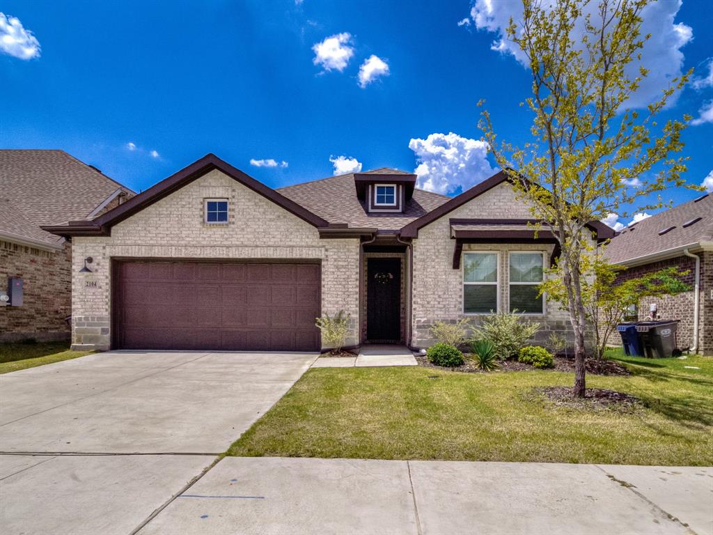 2104 Franklin Road Princeton, TX 75407 - Photo 1 of 36 a front view of a house with a yard and garage
