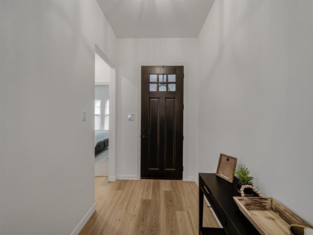 2104 Franklin Road Princeton, TX 75407 - Photo 14 of 36 a view of an empty room with wooden floor