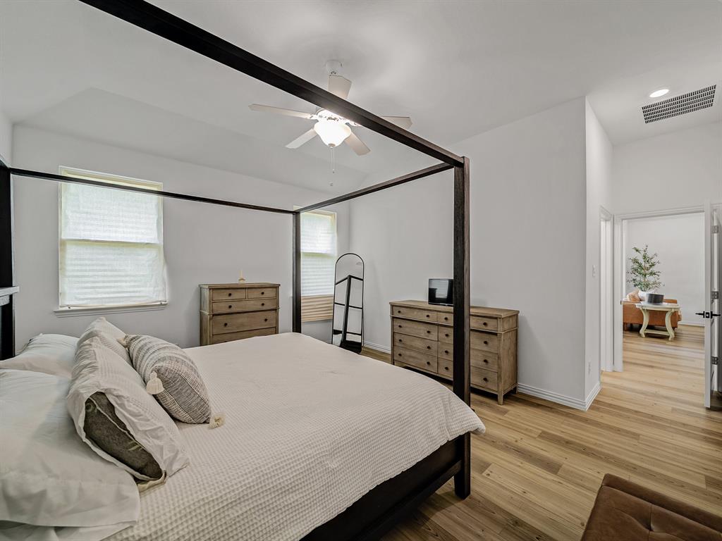 2104 Franklin Road Princeton, TX 75407 - Photo 16 of 36 a bedroom with a bed and a table