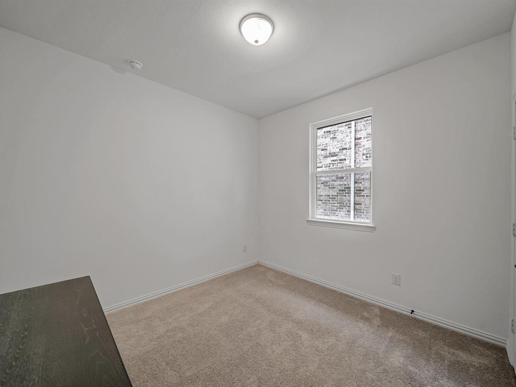 2104 Franklin Road Princeton, TX 75407 - Photo 21 of 36 an empty room with windows