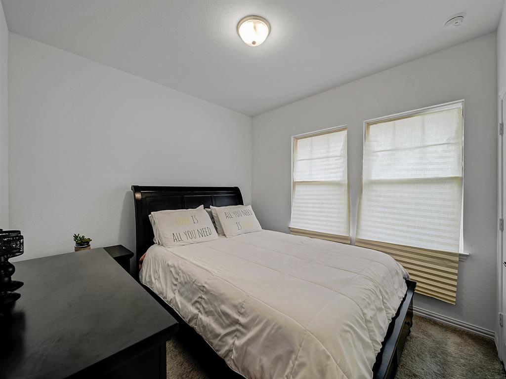 2104 Franklin Road Princeton, TX 75407 - Photo 24 of 36 a bedroom with a bed and a window