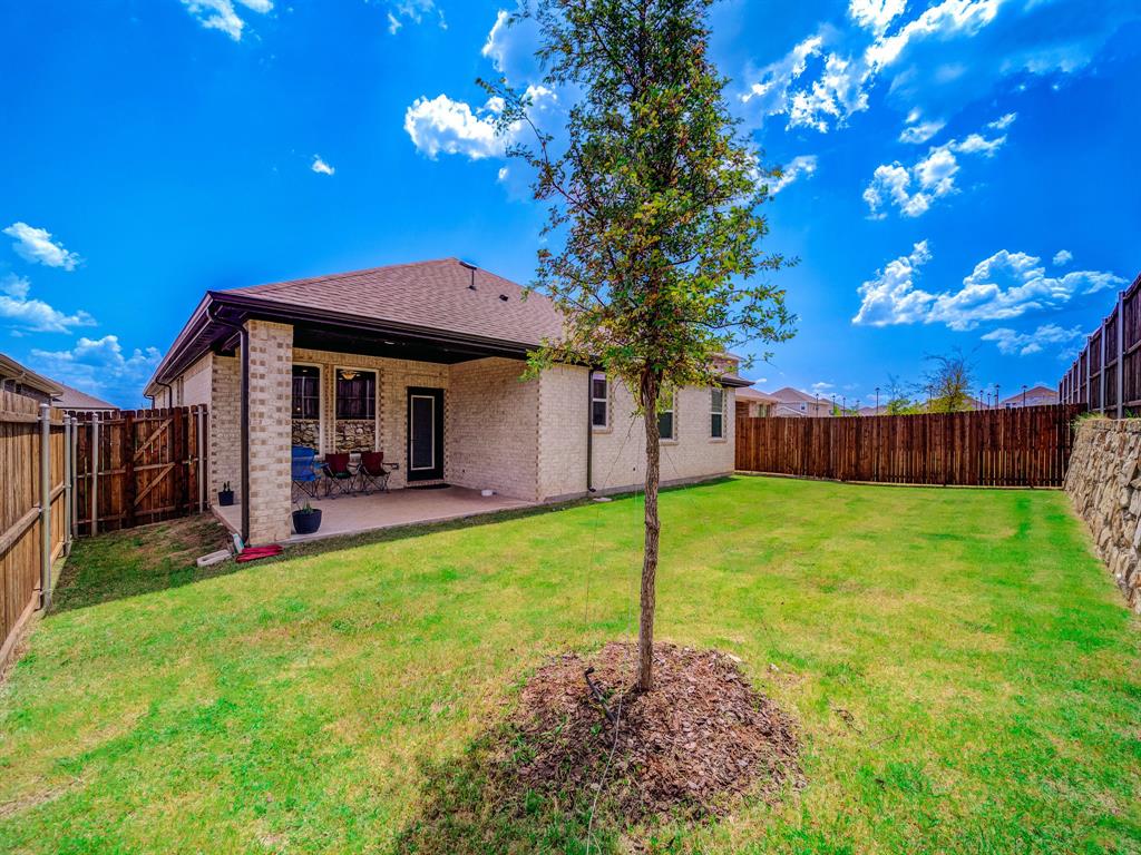 2104 Franklin Road Princeton, TX 75407 - Photo 32 of 36 a front view of a house with garden