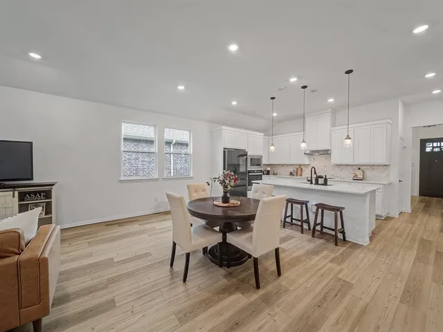 a kitchen with a table and chairs in it