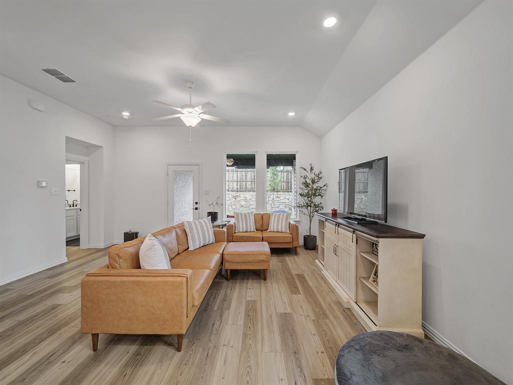 2104 Franklin Road Princeton, TX 75407 - Photo 10 of 36 a living room with furniture and a flat screen tv