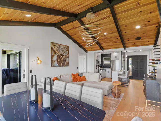 a living room with furniture and wooden floors