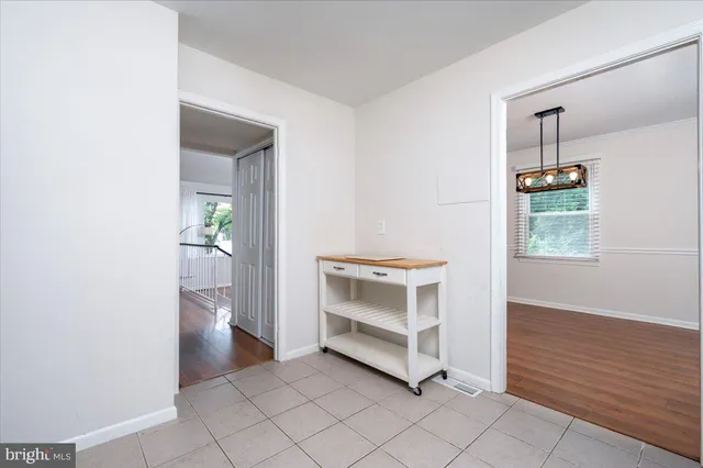 a view of an empty room and fire place
