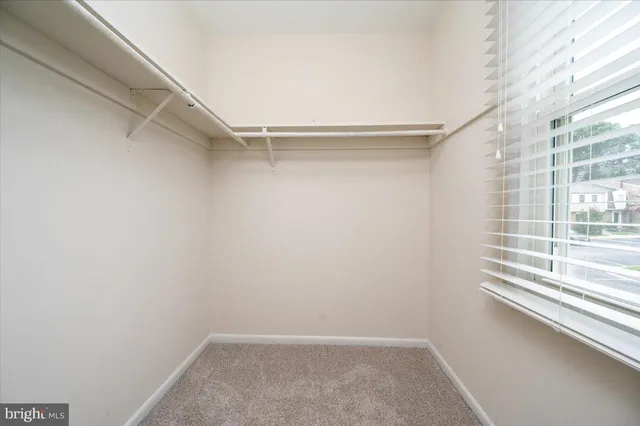 a view of an empty walk in closet