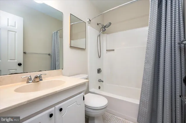 a bathroom with a sink toilet tub and shower