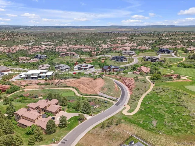 an aerial view of a house with a swimming pool