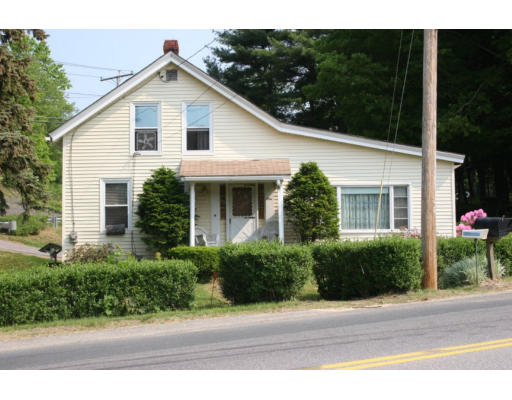 1 Oakham Road North Brookfield, MA 01535 - Photo 1 of 7 a view of a white house next to a yard and trees