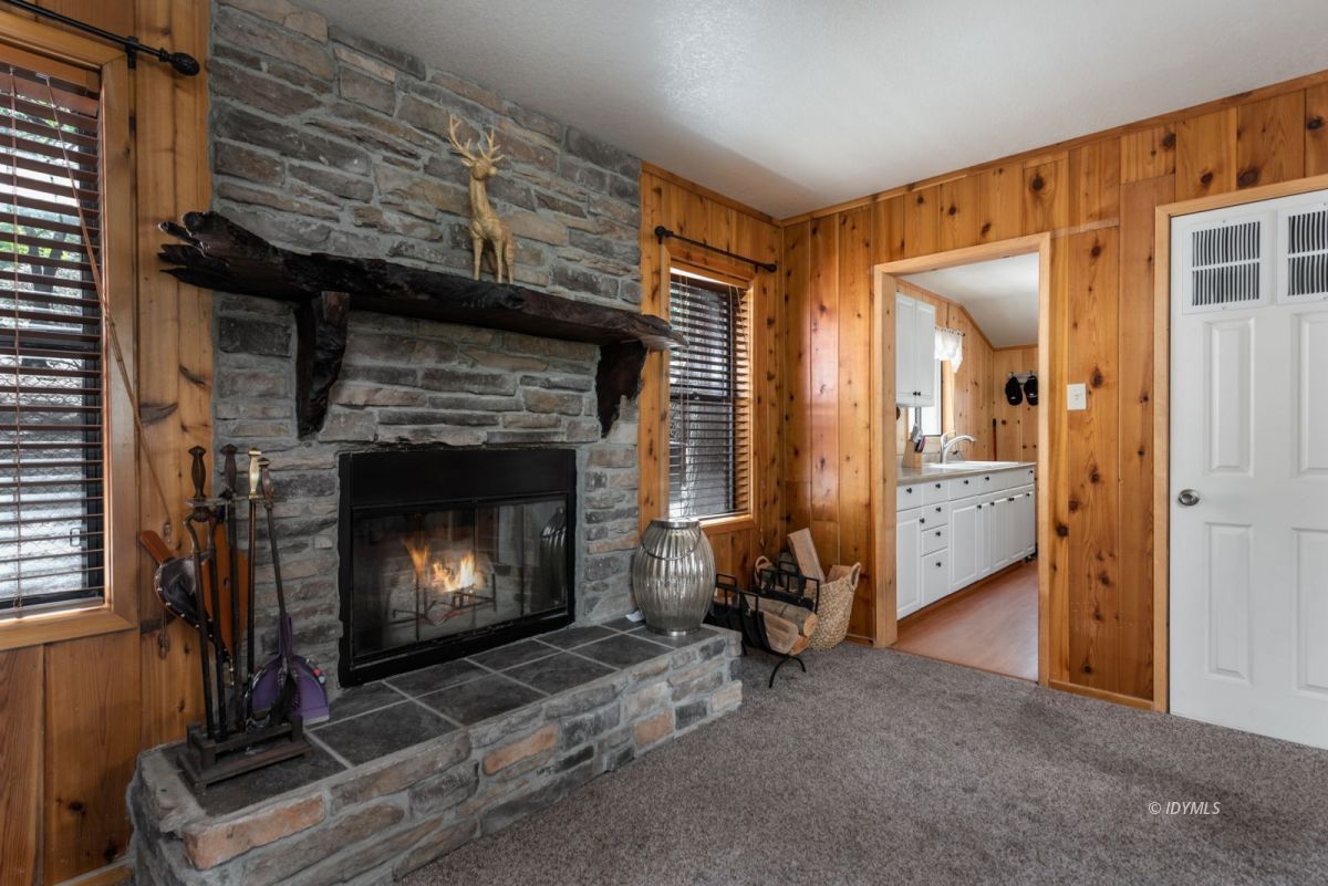 27140 Saunders Meadow Road Idyllwild, CA 92549 - Photo 3 of 25 a living room with furniture and a fireplace