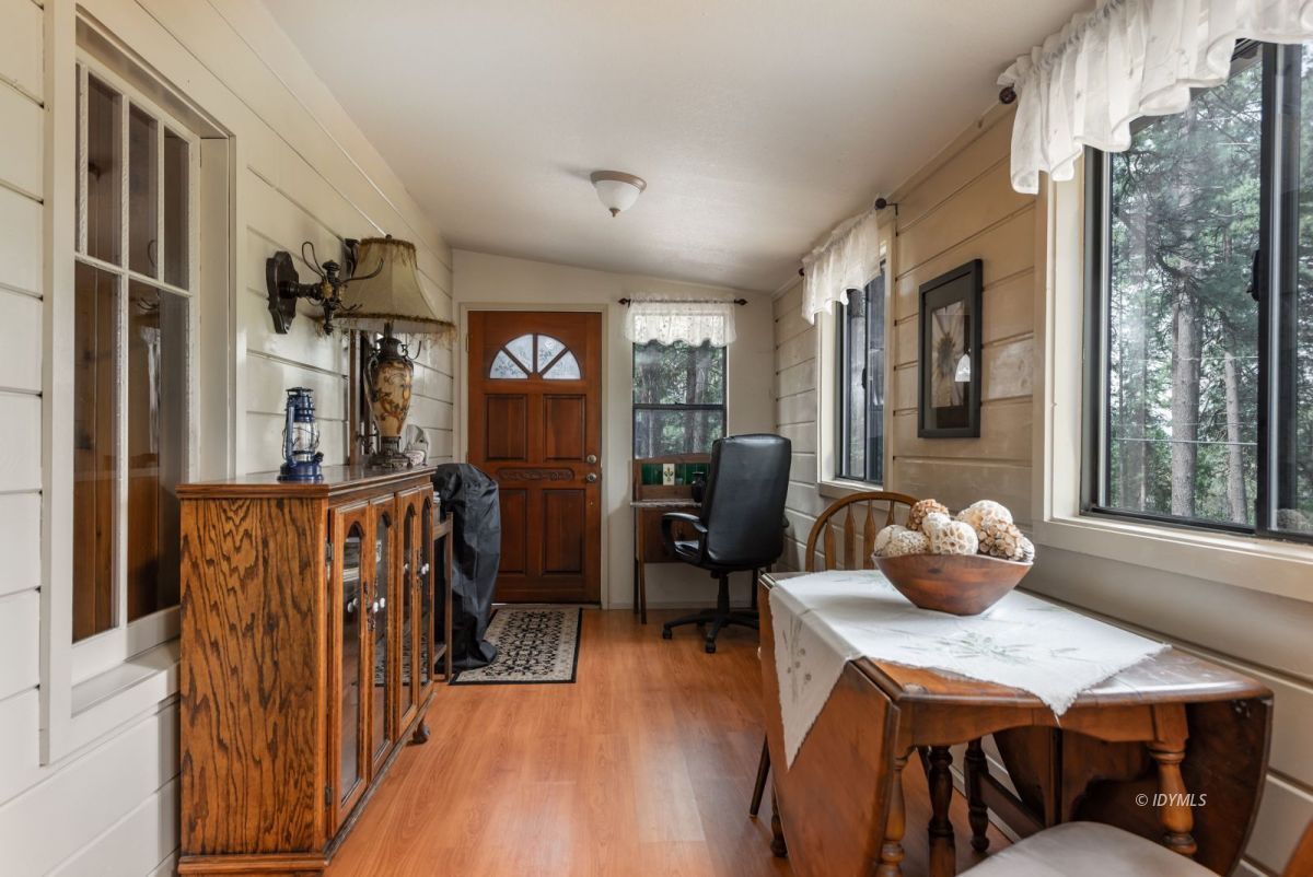27140 Saunders Meadow Road Idyllwild, CA 92549 - Photo 6 of 25 a dining room with furniture and wooden floor