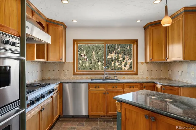 a kitchen with a stove and a microwave