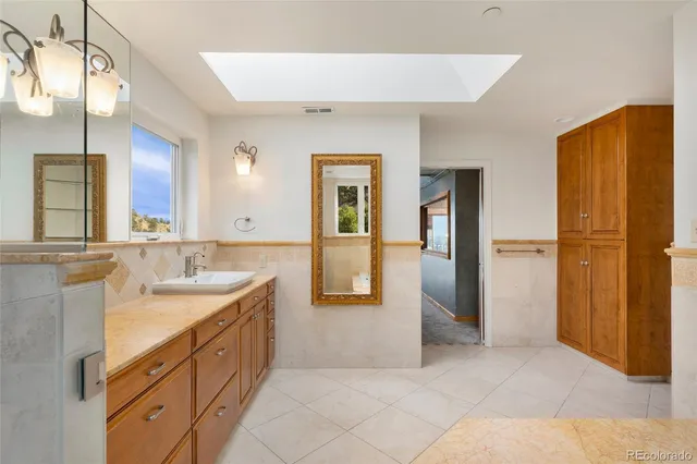 a view of an empty room with glass door and a window