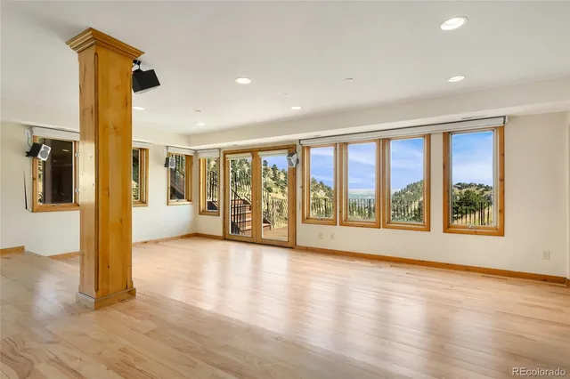 a view of an entryway with wooden floor