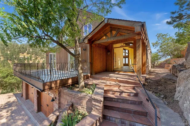 view of a city with lush green forest