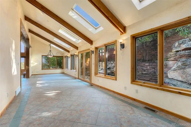 a view of an entryway with a floor to ceiling window