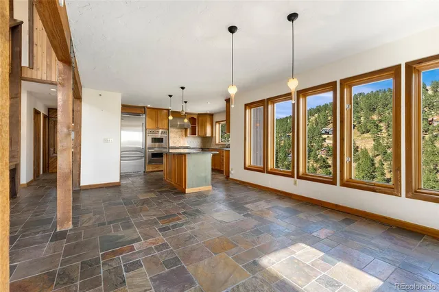 a kitchen with stainless steel appliances granite countertop sink stove and cabinets