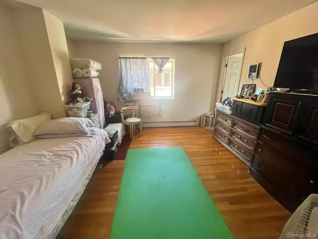 a bed room with a bed and a television