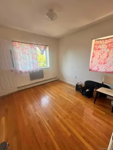 a view of a dining room with furniture and window