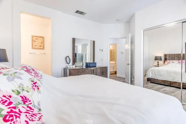 a bedroom with a bed and a couch