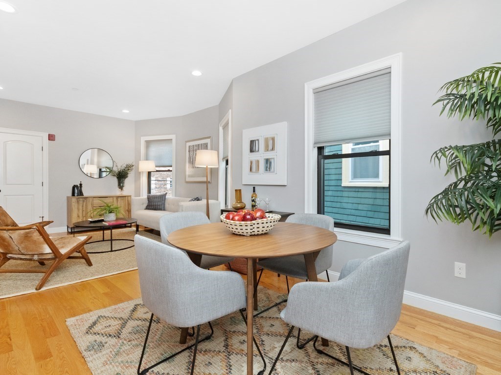 286 Summer Street, Unit 2 Somerville, MA 02144 - Photo 16 of 37 a view of a dining room with furniture and a potted plant