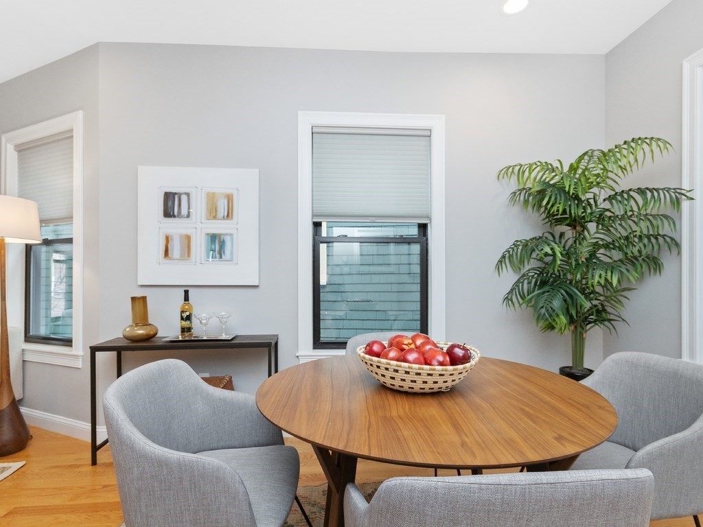 286 Summer Street, Unit 2 Somerville, MA 02144 - Photo 18 of 37 a view of a dining room with furniture and wooden floor