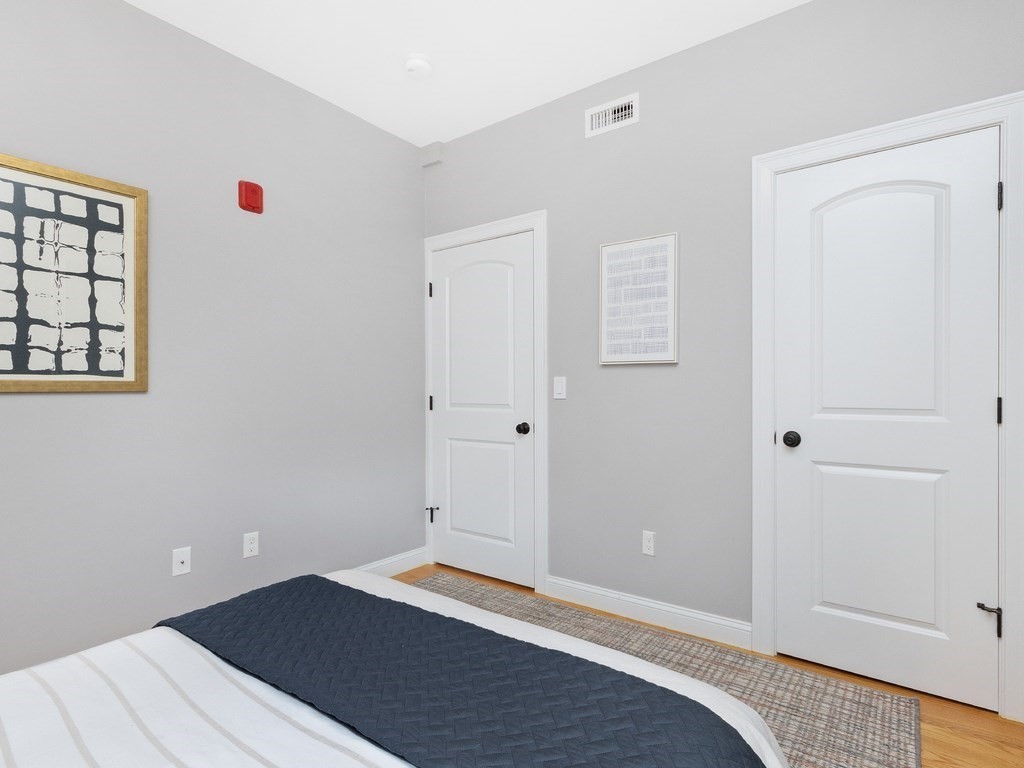 286 Summer Street, Unit 2 Somerville, MA 02144 - Photo 25 of 37 a bedroom with a bed and a window