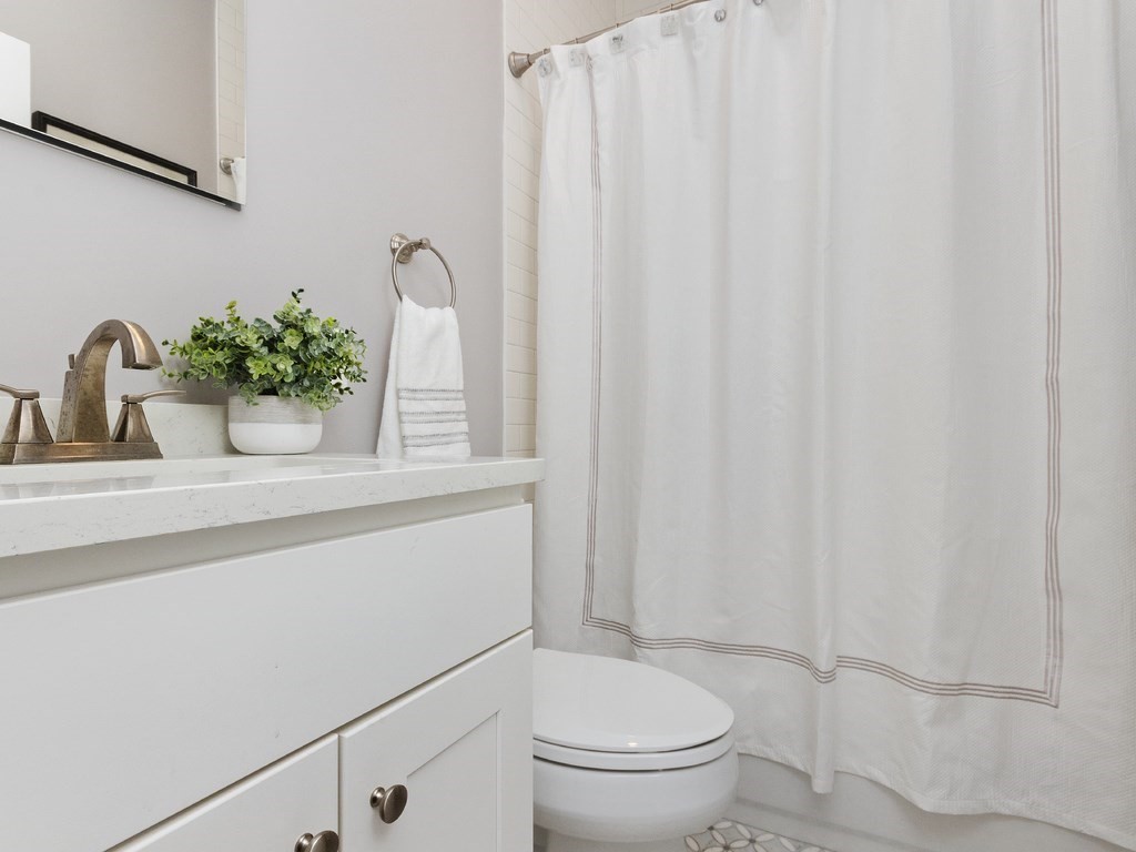 286 Summer Street, Unit 2 Somerville, MA 02144 - Photo 30 of 37 a bathroom with a sink toilet and shower