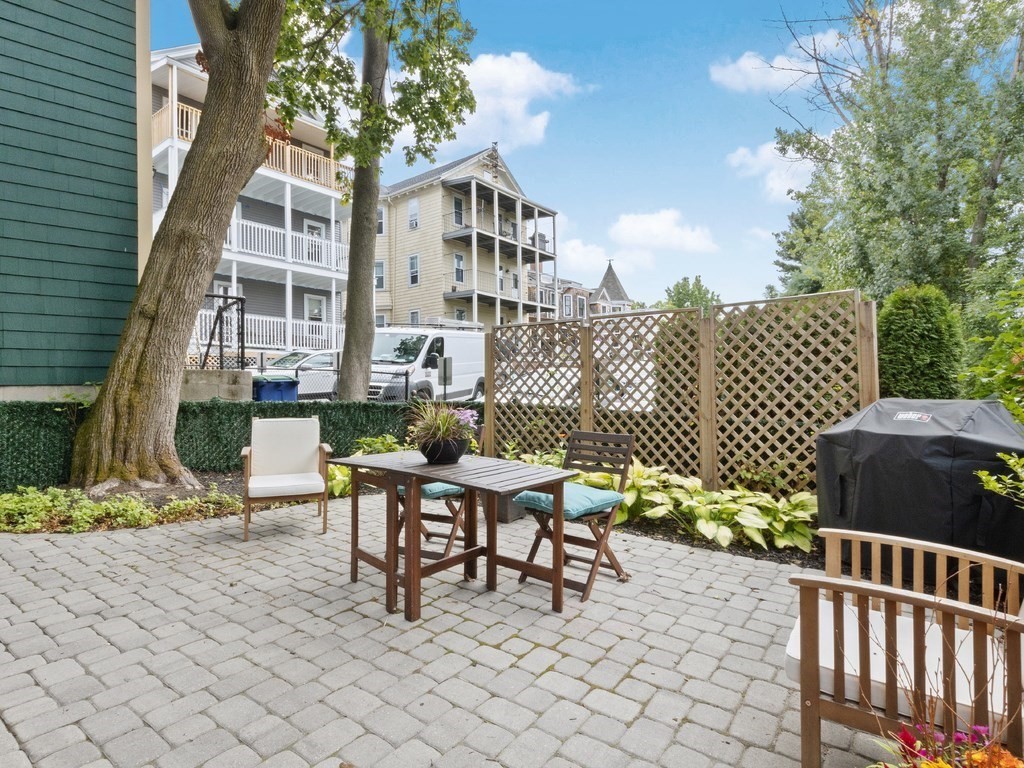 286 Summer Street, Unit 2 Somerville, MA 02144 - Photo 34 of 37 a view of a patio with a table and chairs