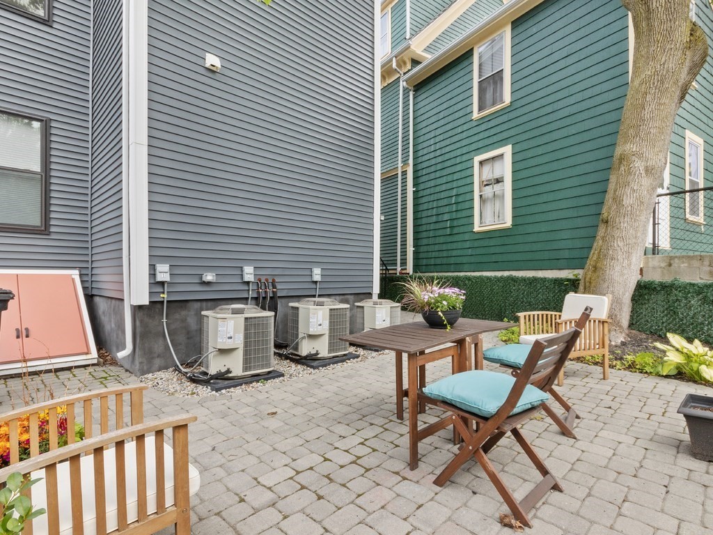 286 Summer Street, Unit 2 Somerville, MA 02144 - Photo 35 of 37 a backyard of a house with outdoor seating