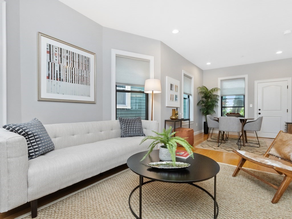 286 Summer Street, Unit 2 Somerville, MA 02144 - Photo 4 of 37 a living room with furniture and wooden floor