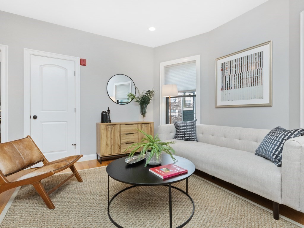 286 Summer Street, Unit 2 Somerville, MA 02144 - Photo 5 of 37 a living room with furniture a rug and a window