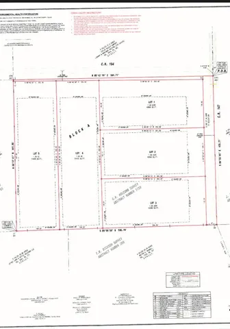 a view of dirt field with trees