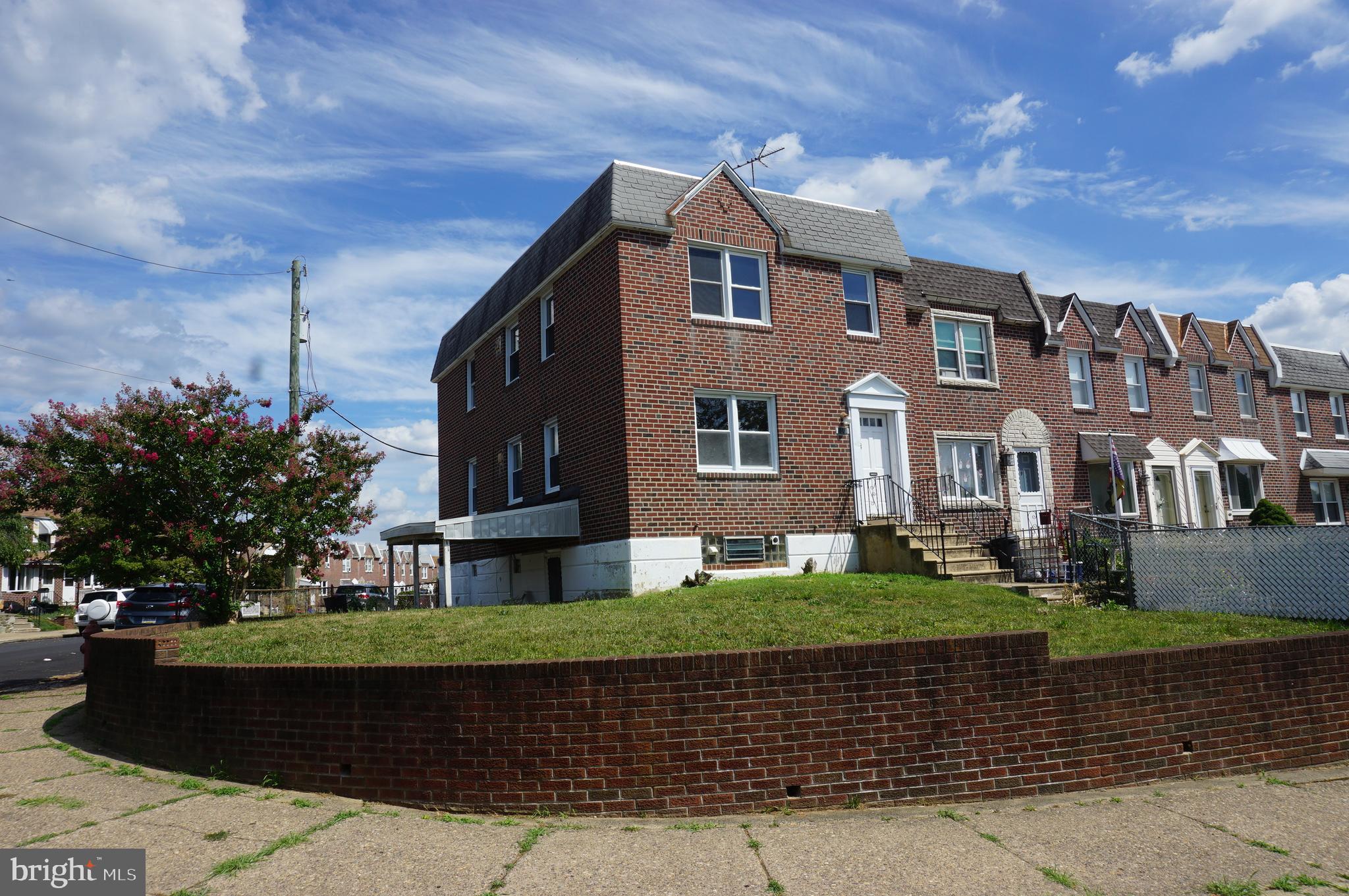 9041 Wesleyan Road Philadelphia, PA 19136 - Photo 1 of 35 a front view of a house with a garden