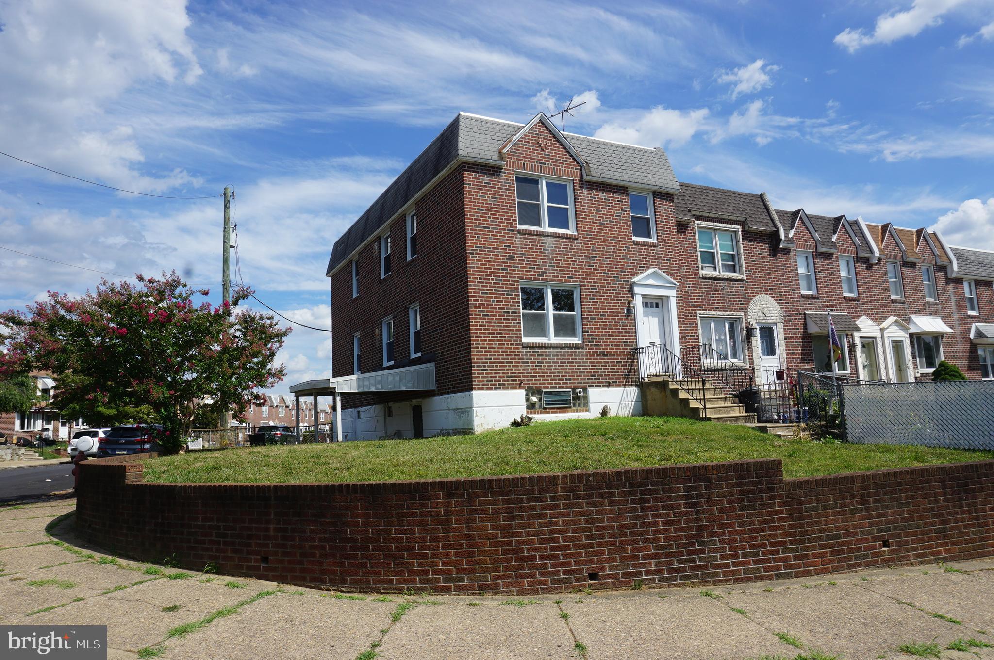 9041 Wesleyan Road Philadelphia, PA 19136 - Photo 2 of 35 a front view of a house with a garden