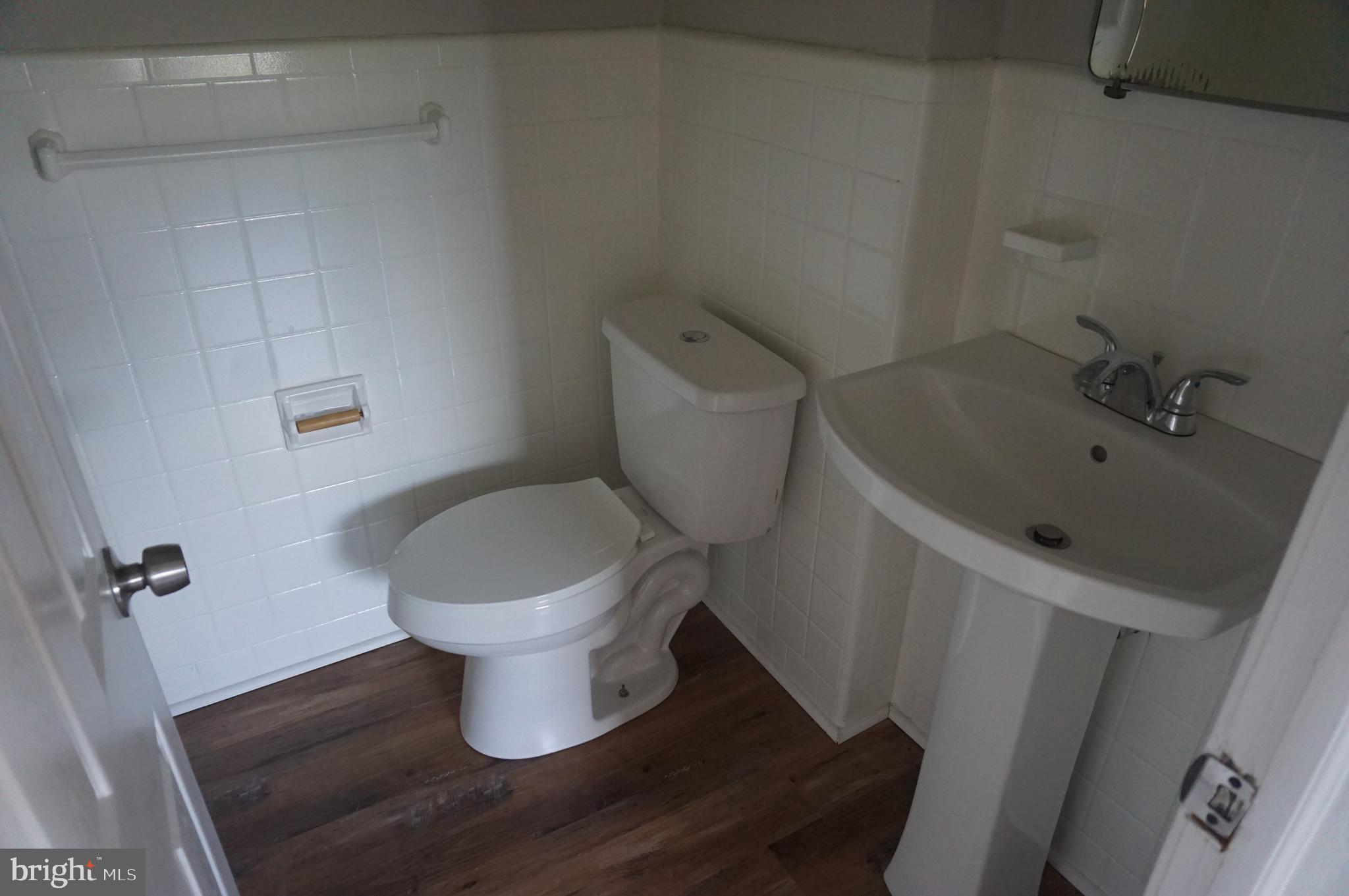 9041 Wesleyan Road Philadelphia, PA 19136 - Photo 25 of 35 a bathroom with a toilet and a sink
