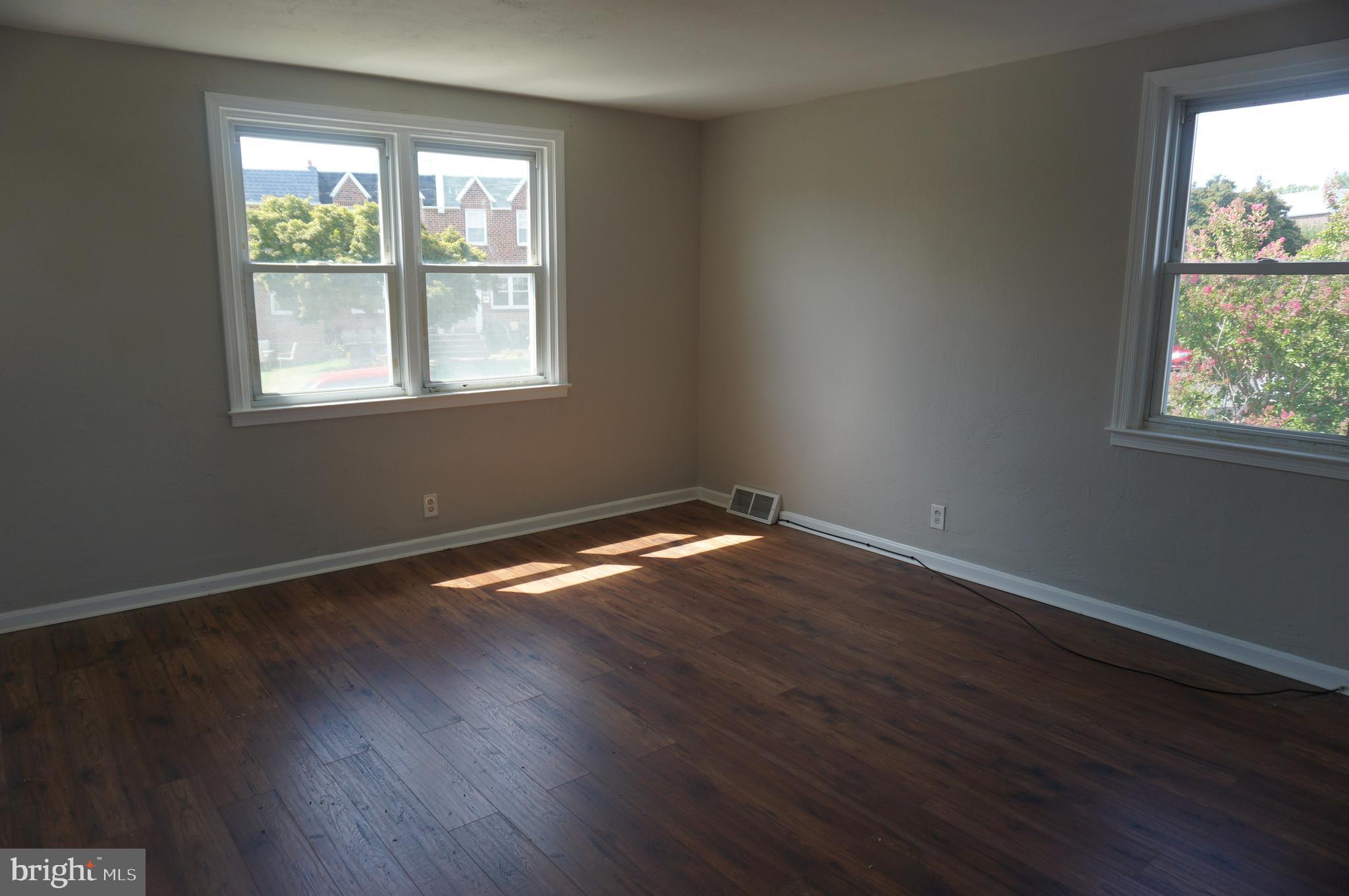 9041 Wesleyan Road Philadelphia, PA 19136 - Photo 26 of 35 an empty room with wooden floor and windows