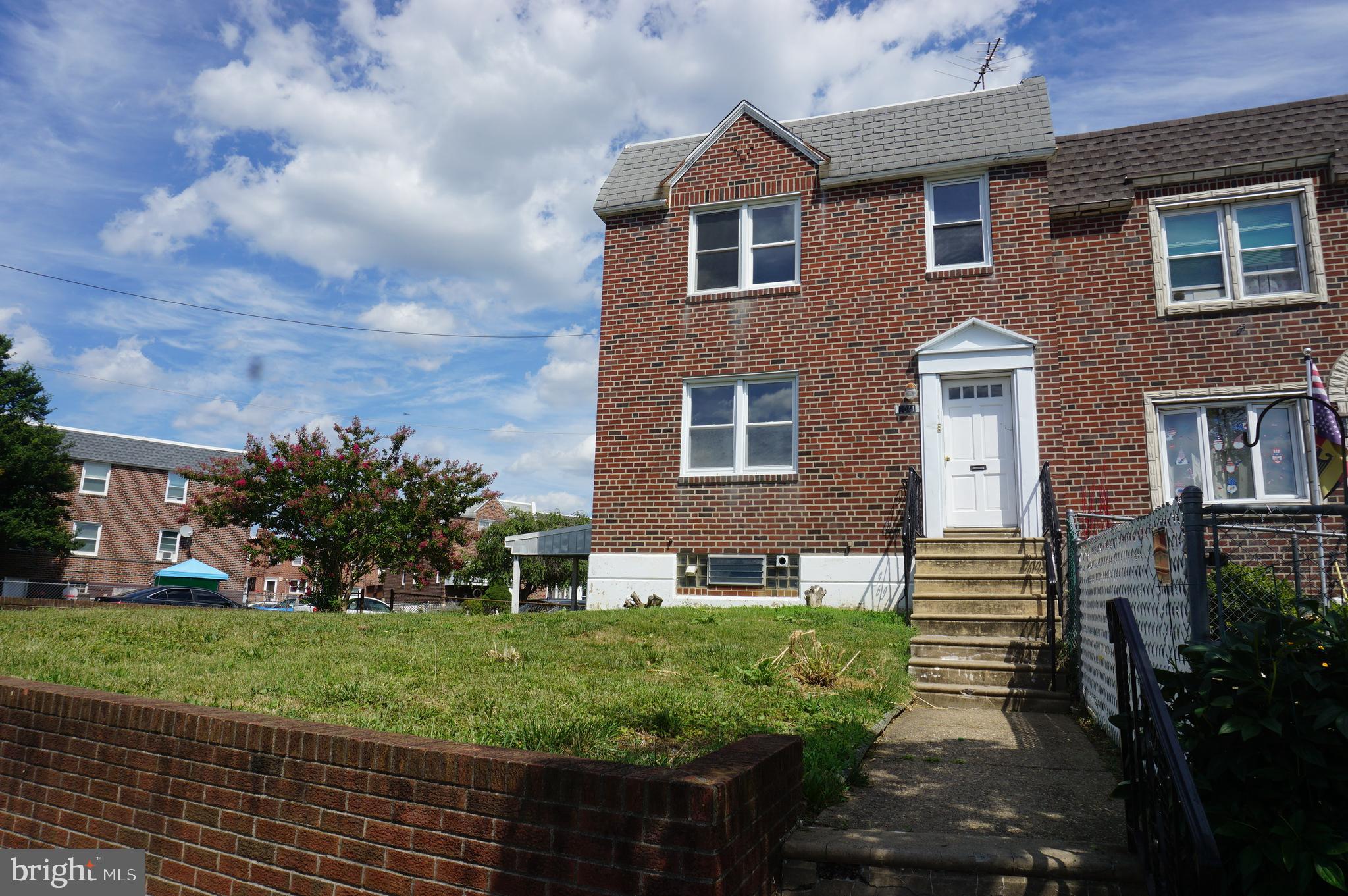 9041 Wesleyan Road Philadelphia, PA 19136 - Photo 4 of 35 a front view of a house with a yard
