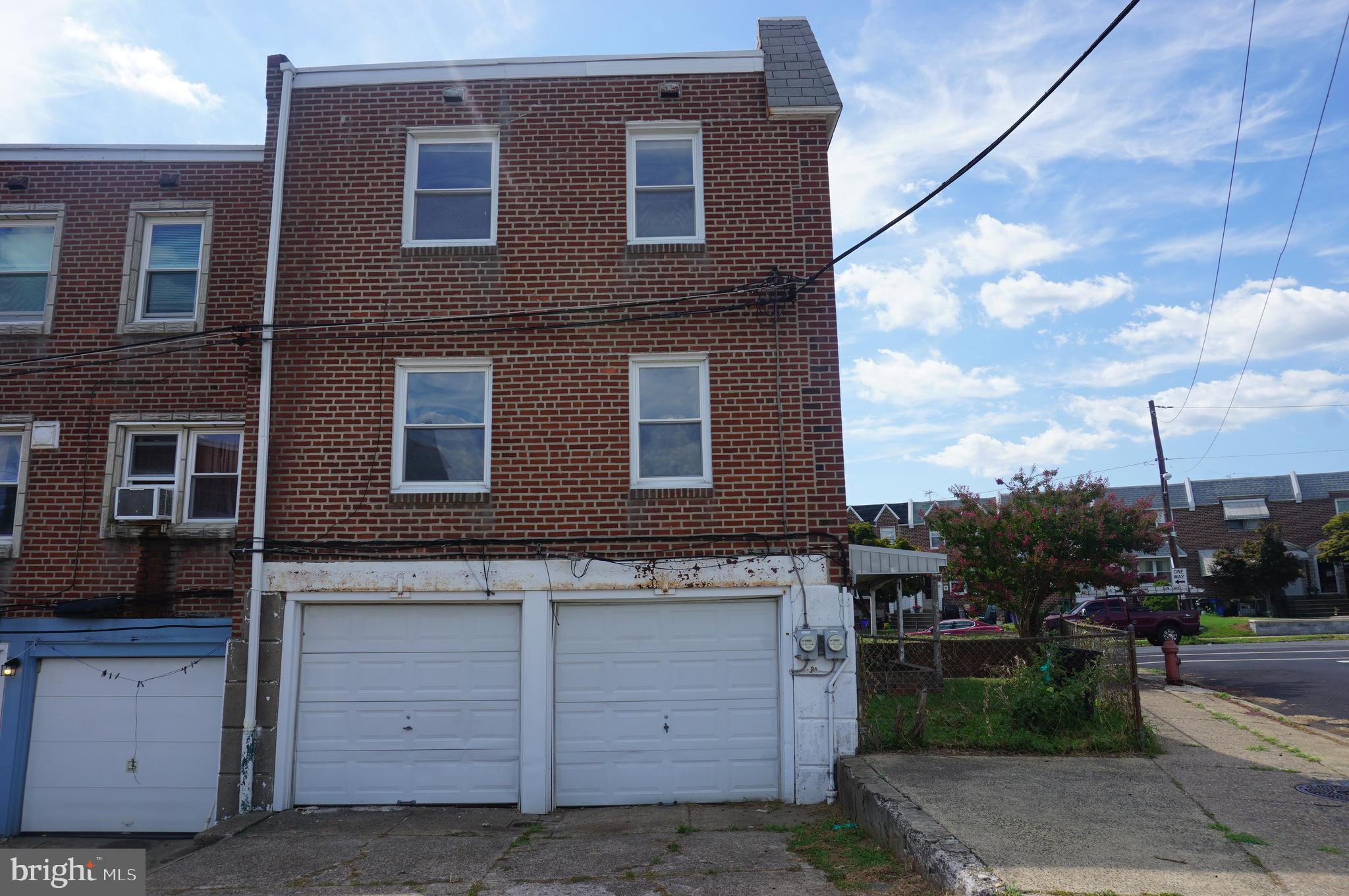 9041 Wesleyan Road Philadelphia, PA 19136 - Photo 8 of 35 a front view of a house with a yard