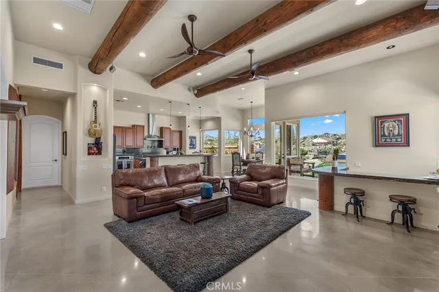 a kitchen with stainless steel appliances granite countertop a stove a sink dishwasher and a refrigerator