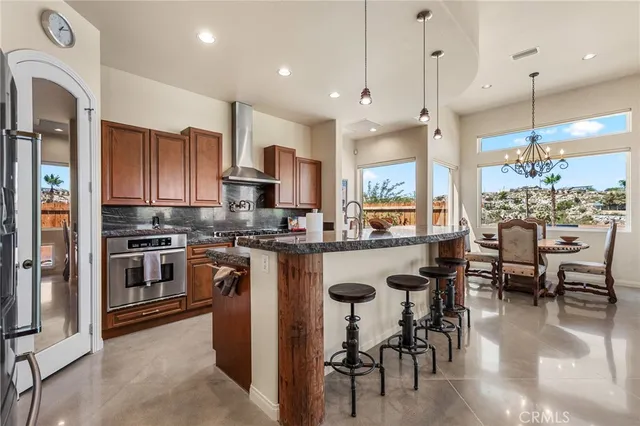 a view of a room with a table and chairs