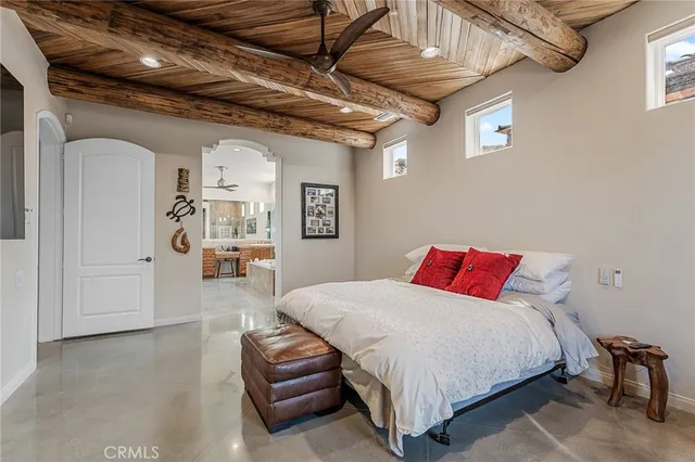 a view of walk in closet with clothes