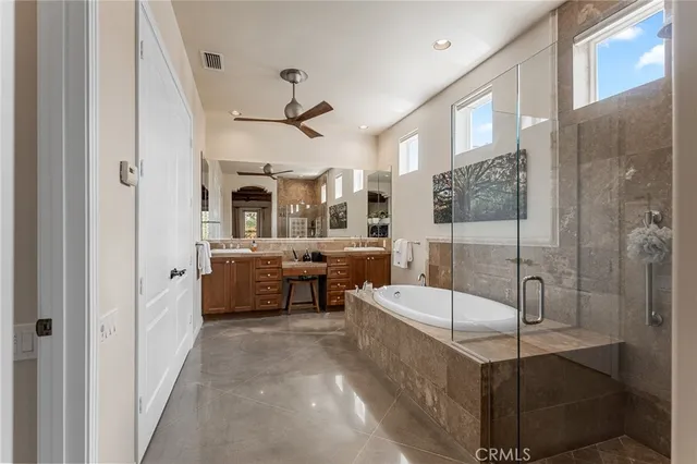 a bedroom with a bed couch and window